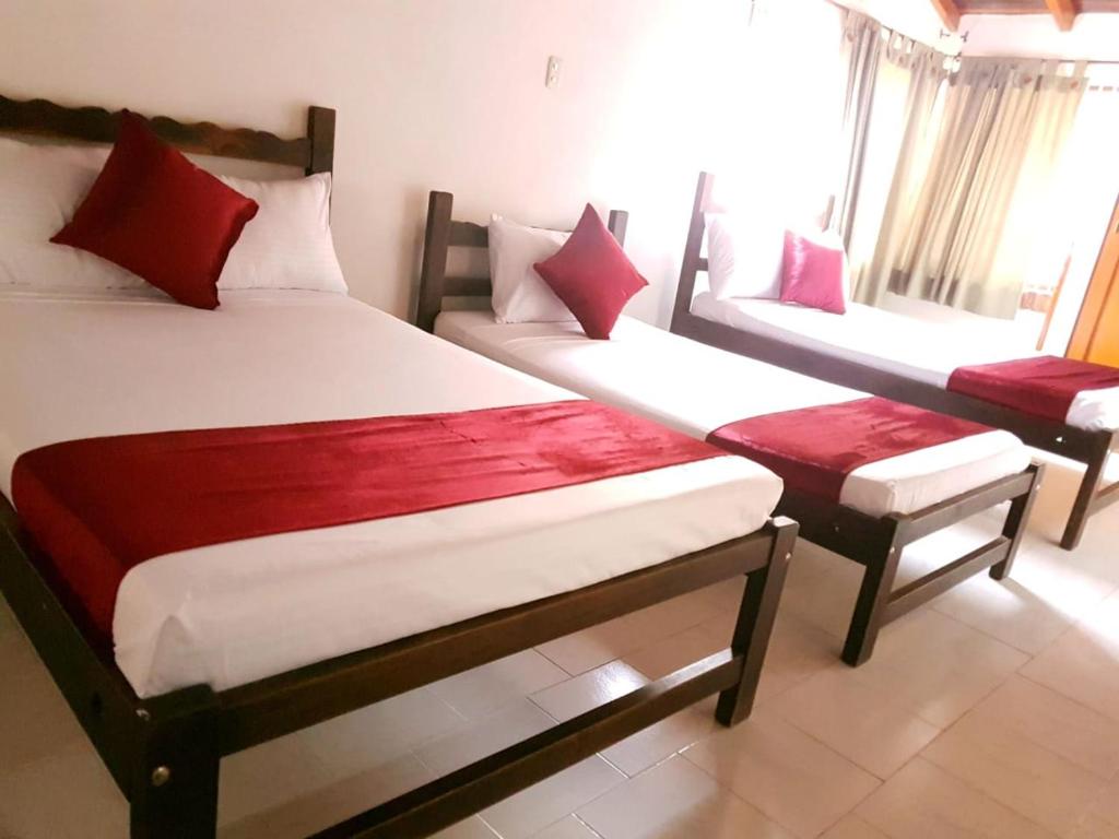 Postel nebo postele na pokoji v ubytování Hotel Don Juan Colonial