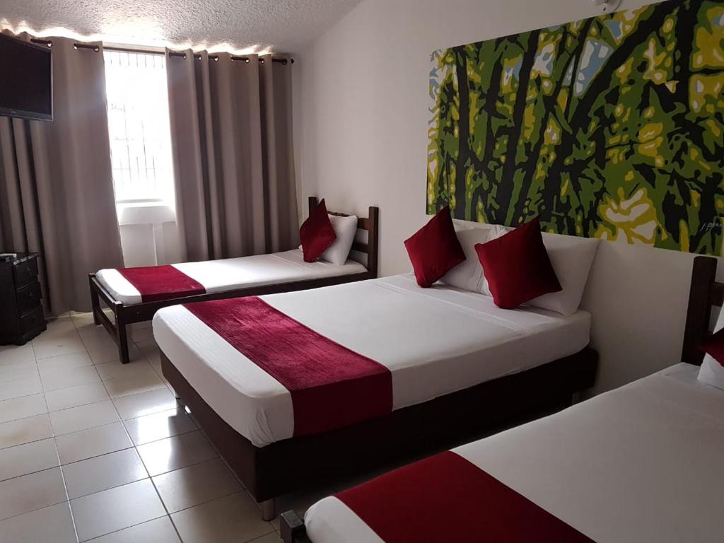 Postel nebo postele na pokoji v ubytování Hotel Don Juan Colonial