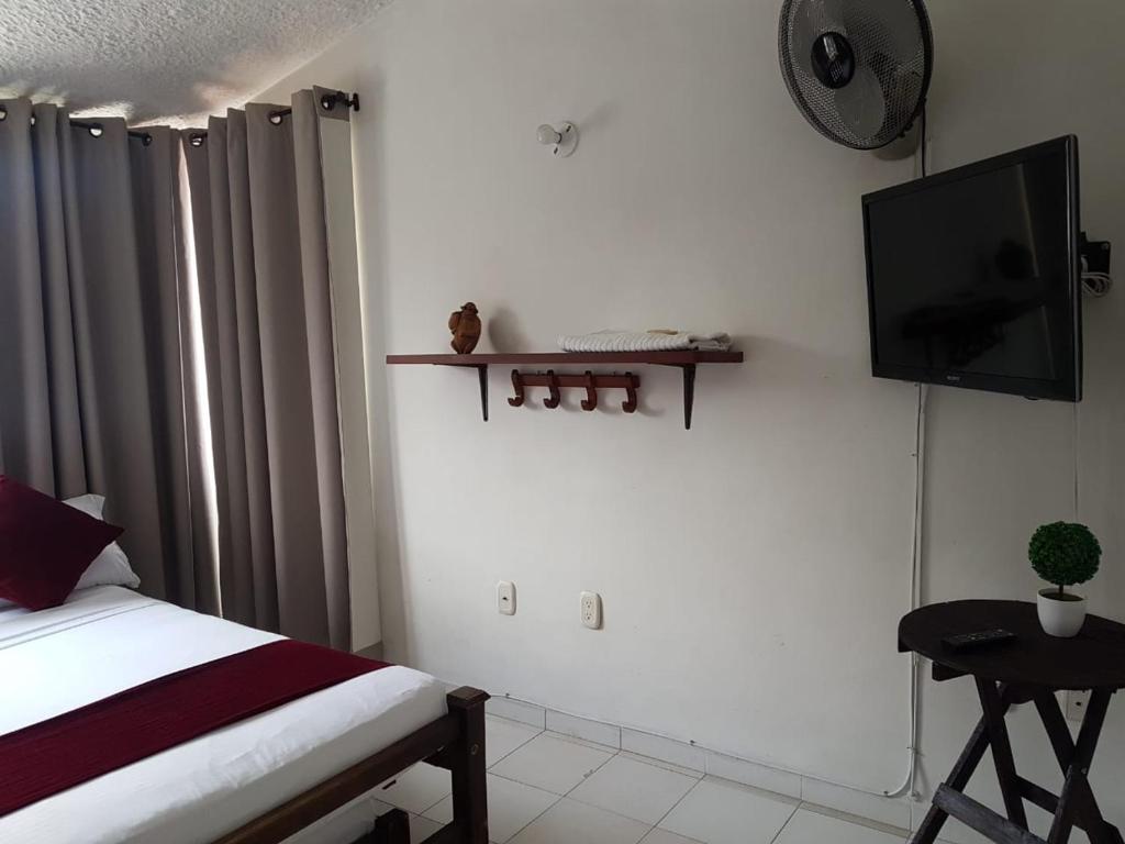 TV a/nebo společenská místnost v ubytování Hotel Don Juan Colonial
