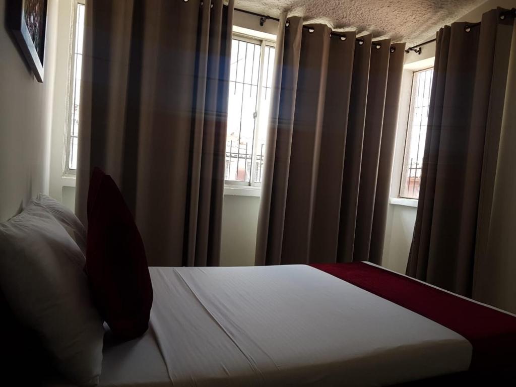 Postel nebo postele na pokoji v ubytování Hotel Don Juan Colonial