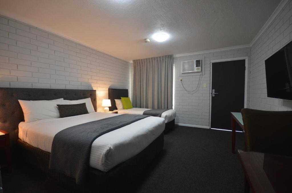 Postel nebo postele na pokoji v ubytování Frewville Motor Inn