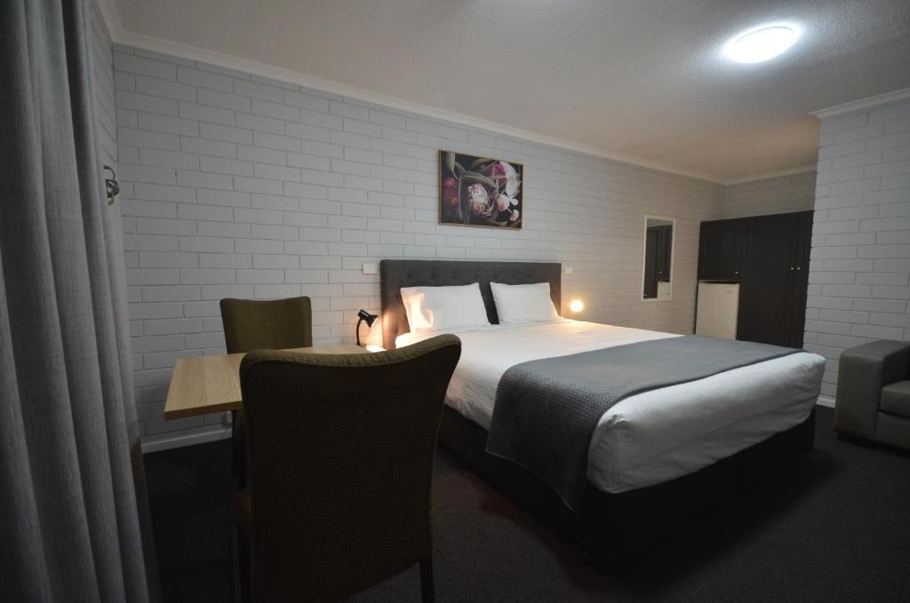 Postel nebo postele na pokoji v ubytování Frewville Motor Inn
