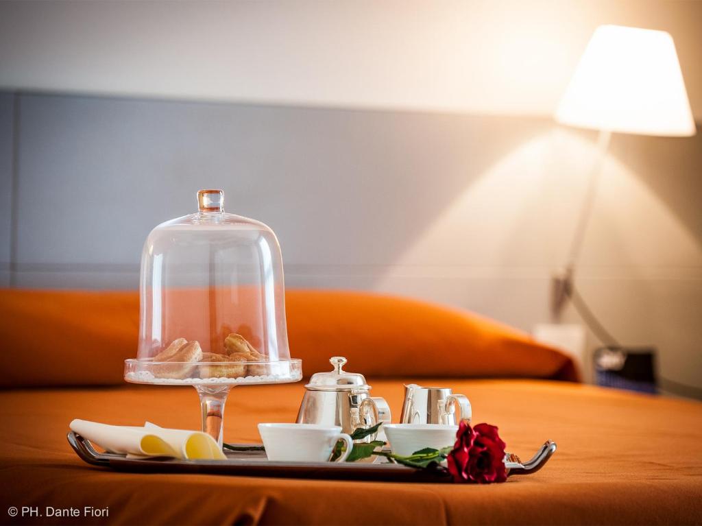 Postel nebo postele na pokoji v ubytování Schio Hotel