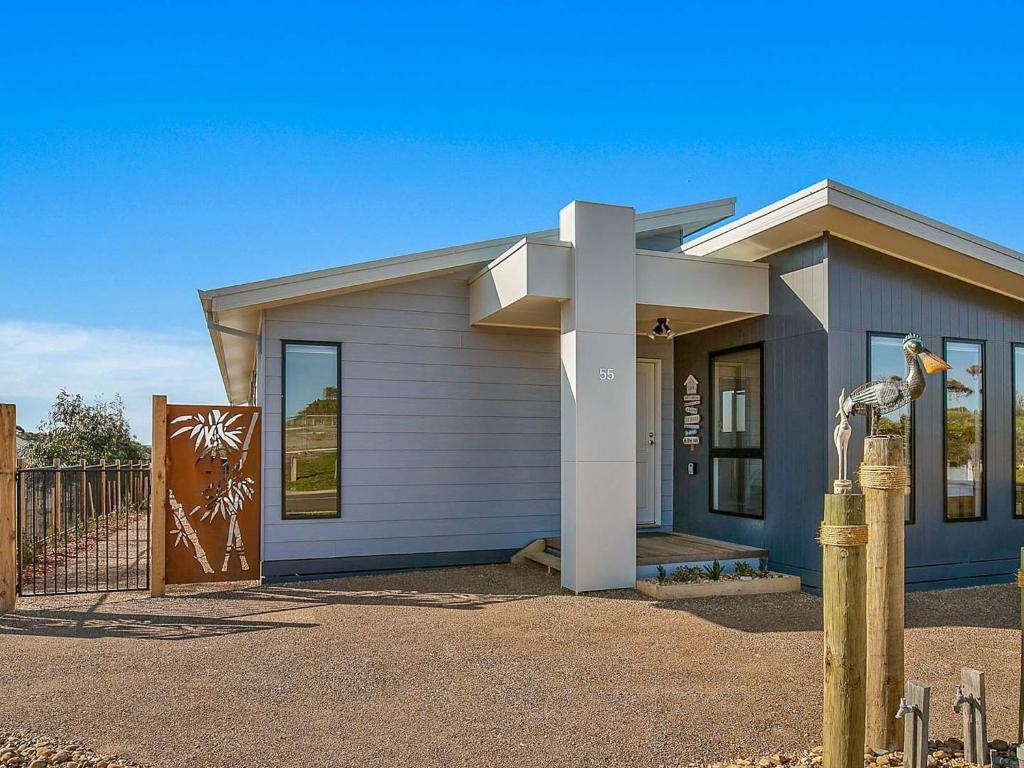 a small house with a gate in front of it at Mabuhay in Cowes