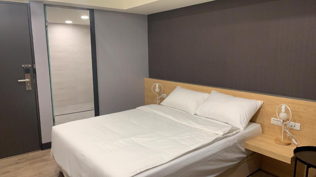 Postel nebo postele na pokoji v ubytování CY Hotel