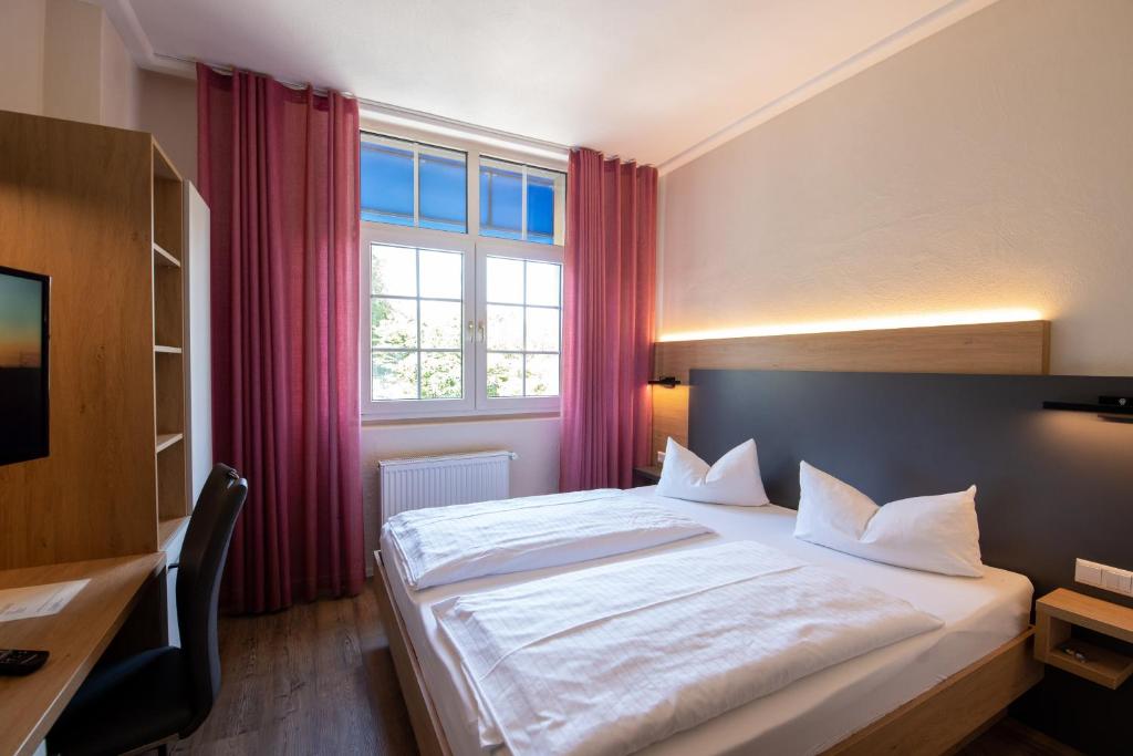 Postel nebo postele na pokoji v ubytování Hotel Avisa