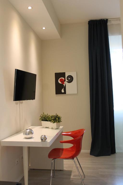 Televízia a/alebo spoločenská miestnosť v ubytovaní Little Rose Lodge