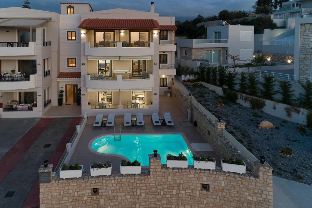 an aerial view of a building with a swimming pool at Zen Luxury Home, Family Sea Escape! in Magnisía