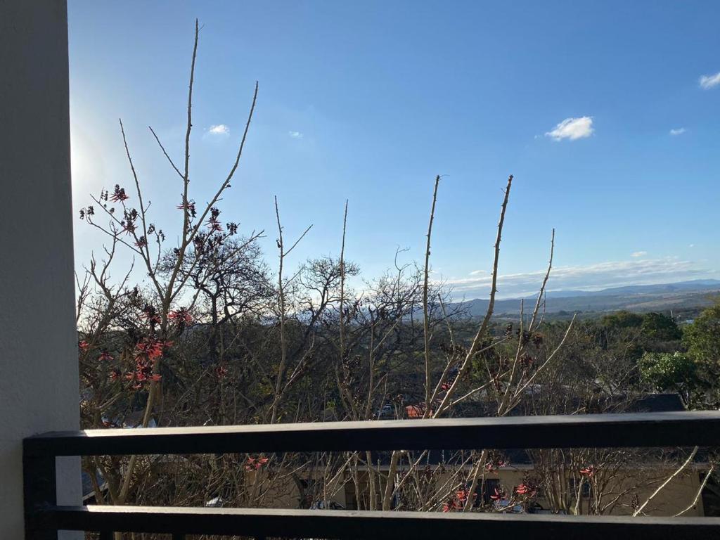 a view of the mountains from a balcony at Spring Acres Apartment living in Nelspruit