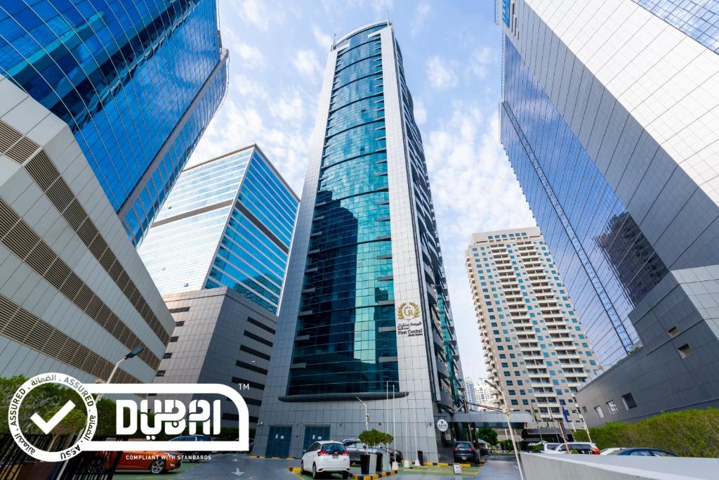 a city street with tall buildings and tall buildings at First Central Hotel Suites in Dubai