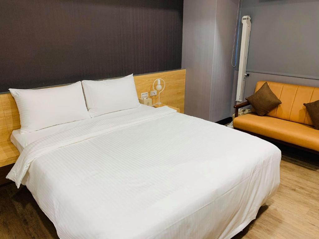 Postel nebo postele na pokoji v ubytování CY Hotel