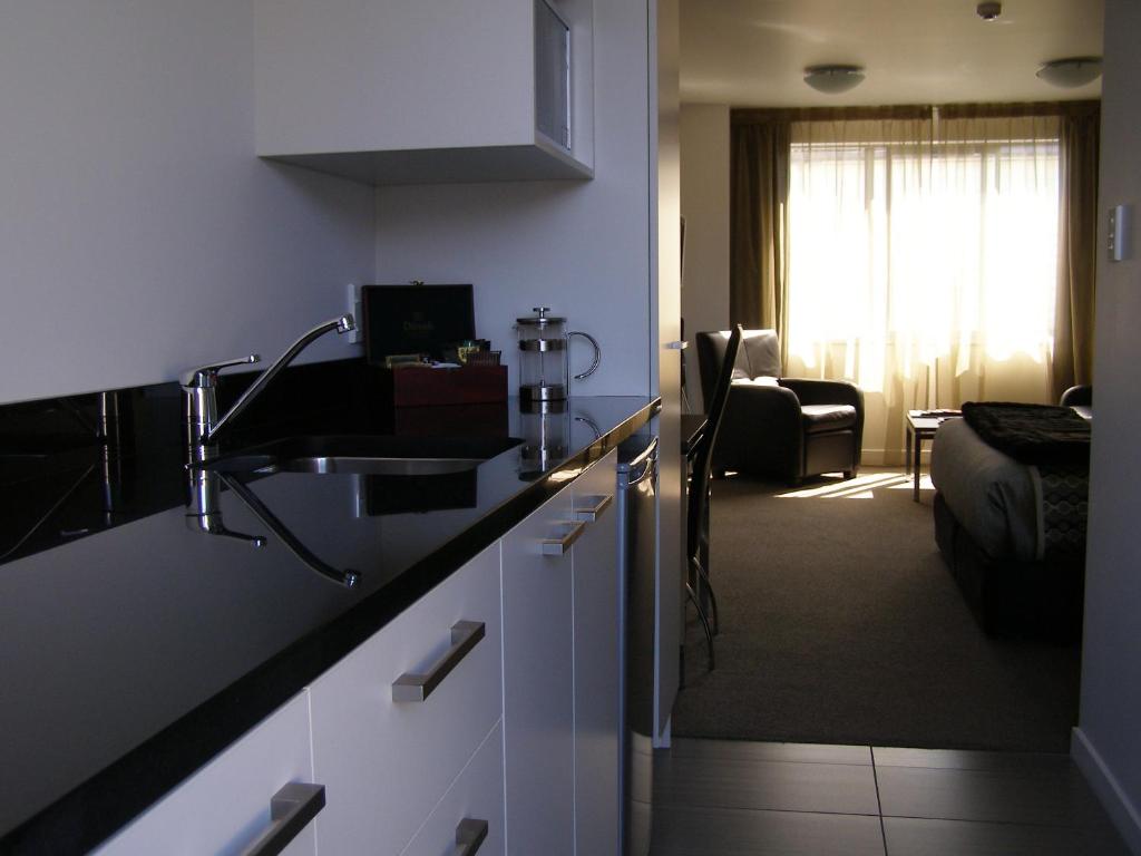 Kuchyň nebo kuchyňský kout v ubytování Bellano Motel Suites