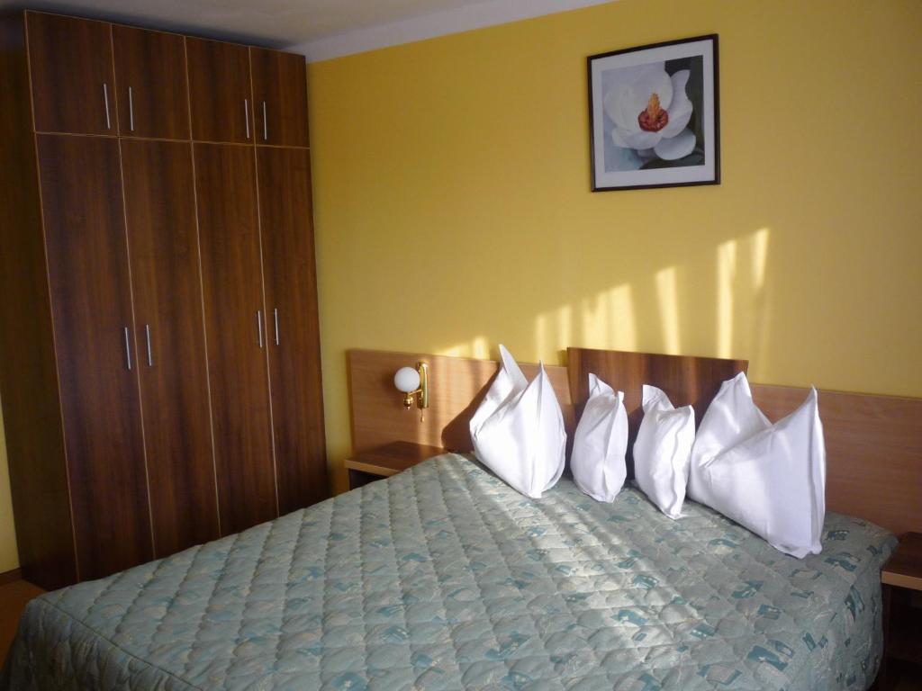 Postel nebo postele na pokoji v ubytování Hotel Sud