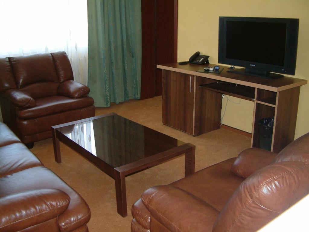 TV a/nebo společenská místnost v ubytování Hotel Sud