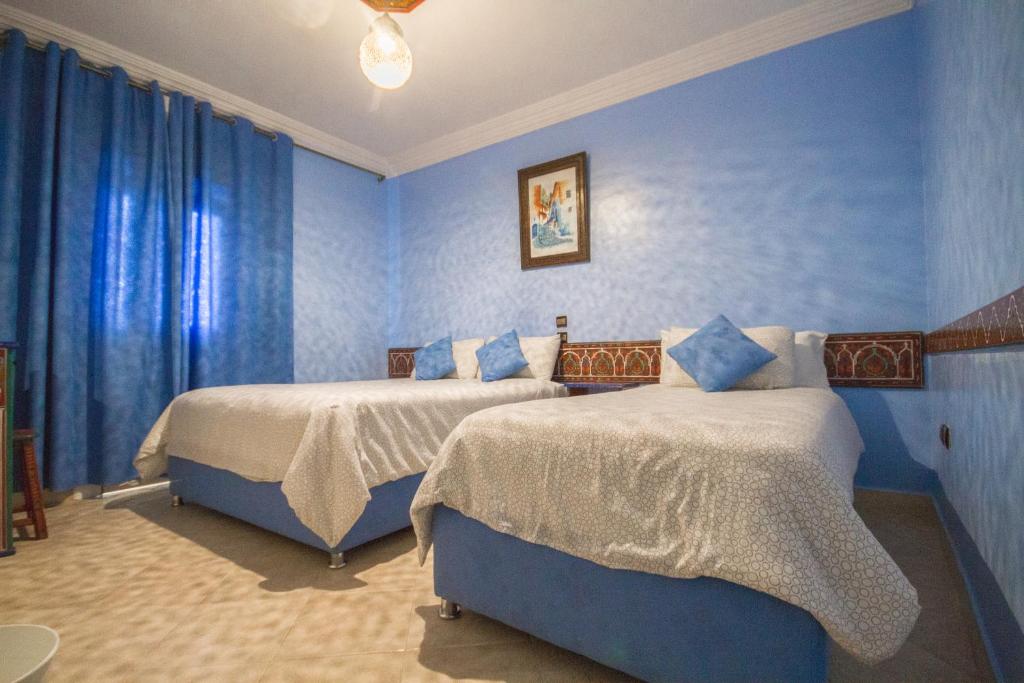 Postel nebo postele na pokoji v ubytování Hotel Tarek