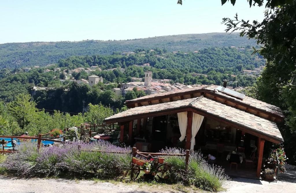 a small building with a view of a valley at Country House Antiche Dimore in Abbateggio