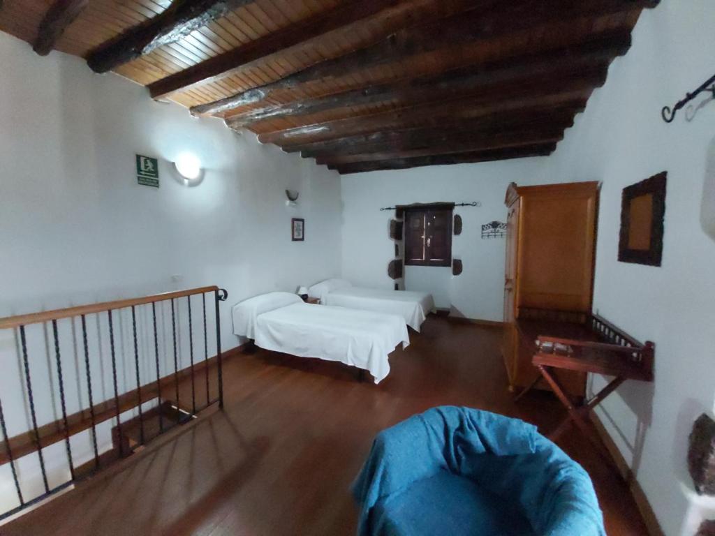 Postel nebo postele na pokoji v ubytování Casa los Abuelos