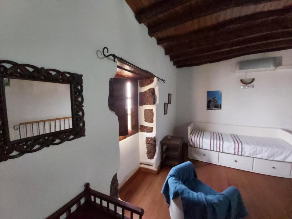 Postel nebo postele na pokoji v ubytování Casa los Abuelos