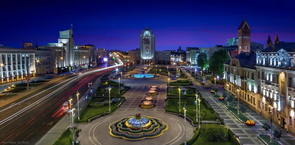 a city street at night with lights on at Aparton Home in Minsk