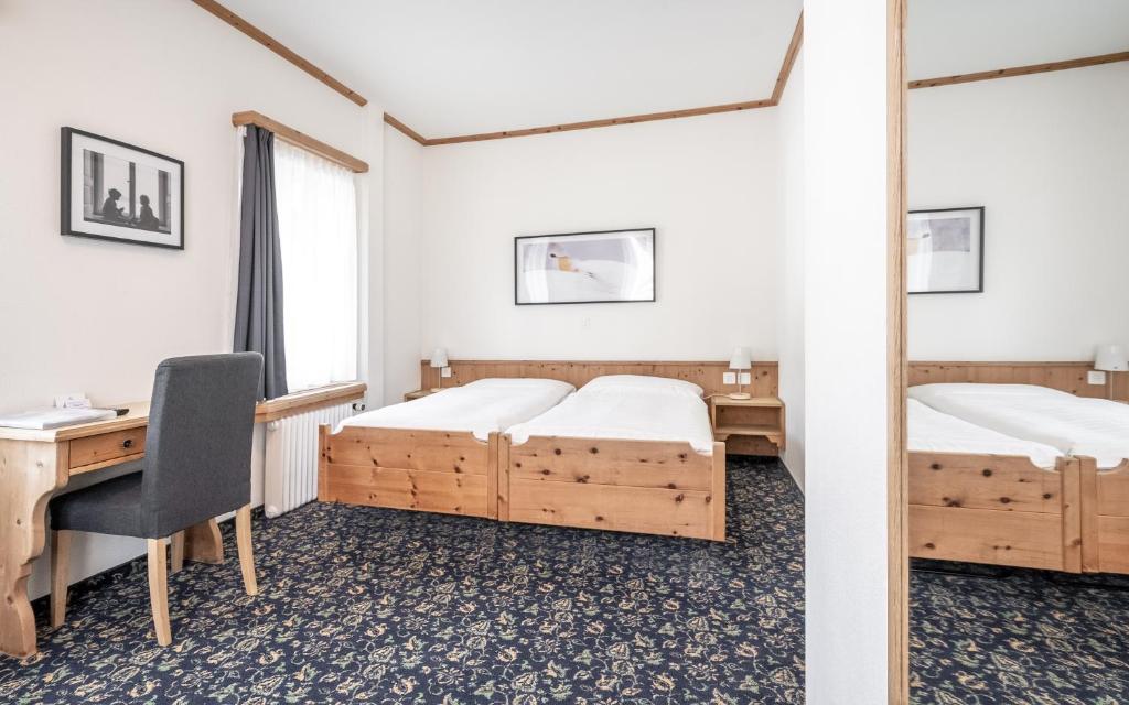 Postel nebo postele na pokoji v ubytování Hotel Alte Post by Mountain Hotels