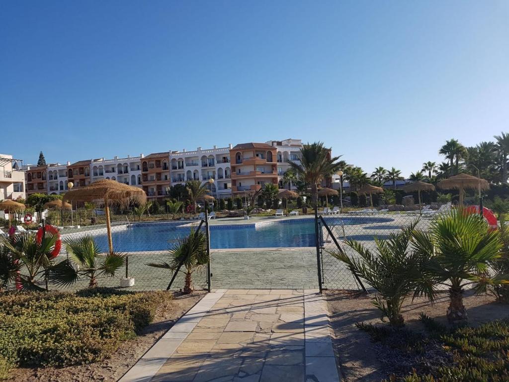 Bazén v ubytovaní DUPLEX ESPECTACULAR en PRIMERA LÍNEA NATURISTA! alebo v jeho blízkosti