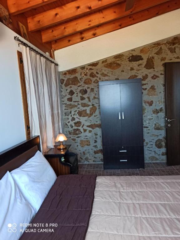 Postel nebo postele na pokoji v ubytování Aretis sea view house