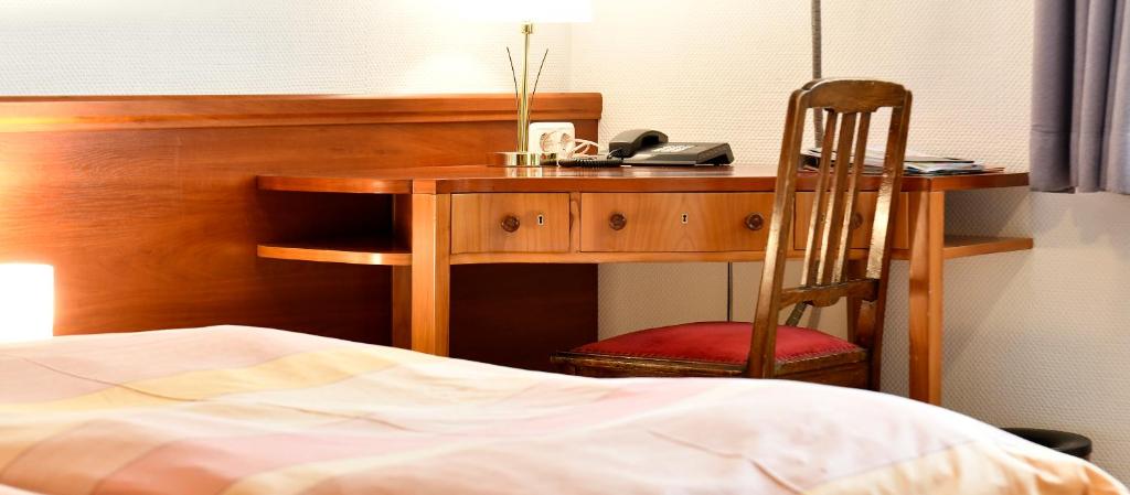 Postel nebo postele na pokoji v ubytování Landhotel Schwarzes Ross