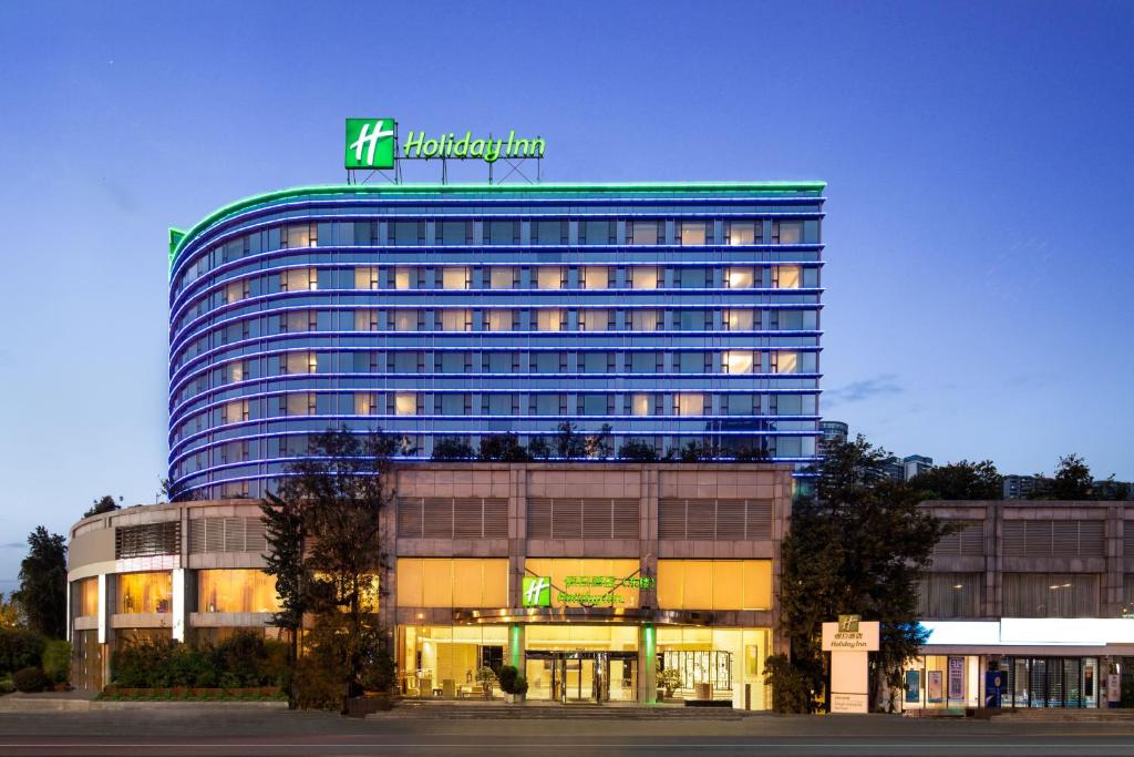 a building with a sign on top of it at Holiday Inn Chengdu Century City - East, an IHG Hotel in Chengdu