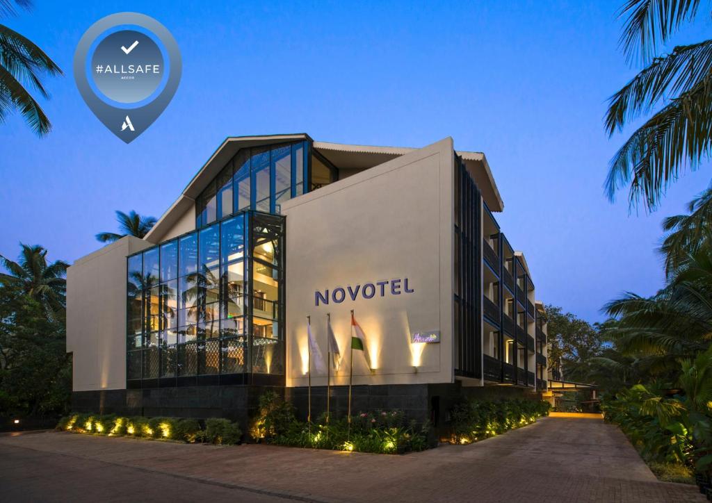 a building with a moveel sign on the side of it at Novotel Goa Resort & Spa Candolim in Candolim