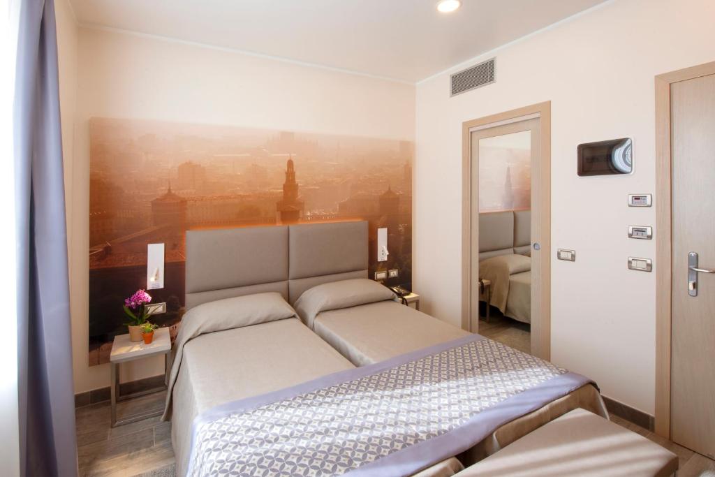 Postel nebo postele na pokoji v ubytování Hotel Sempione