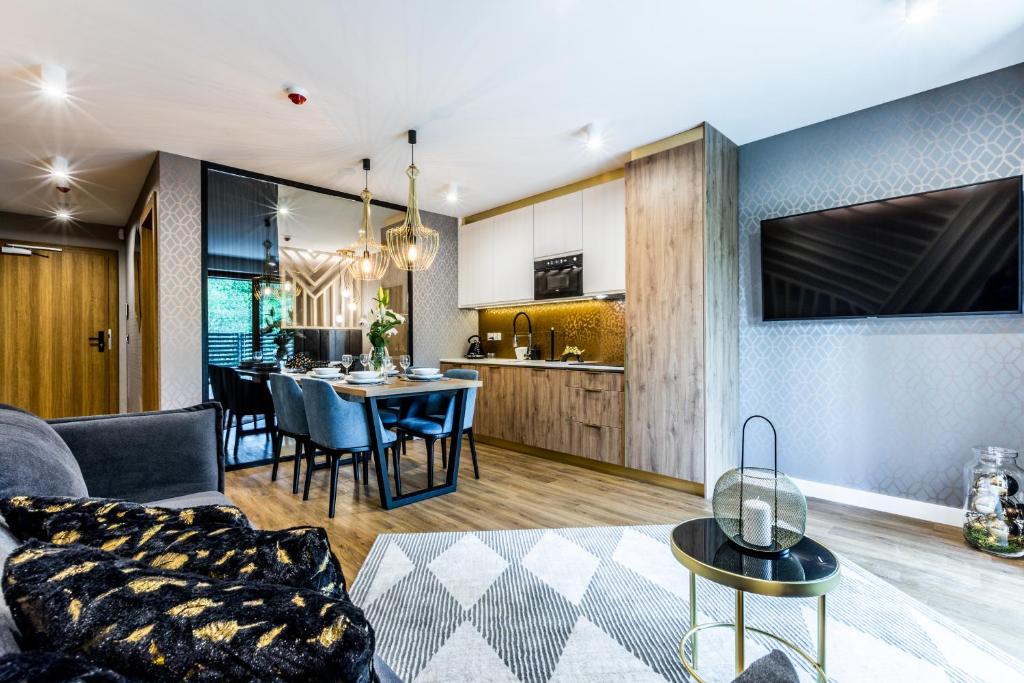 Televízia a/alebo spoločenská miestnosť v ubytovaní Aparthotel Prestige & SPA