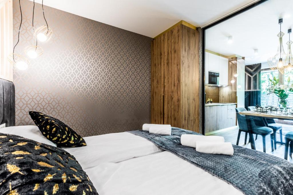 Posteľ alebo postele v izbe v ubytovaní Aparthotel Prestige & SPA