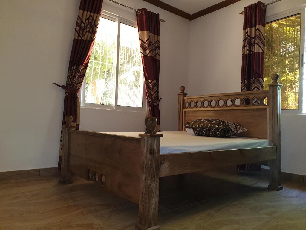 Postel nebo postele na pokoji v ubytování Karibuni palace mtwapa