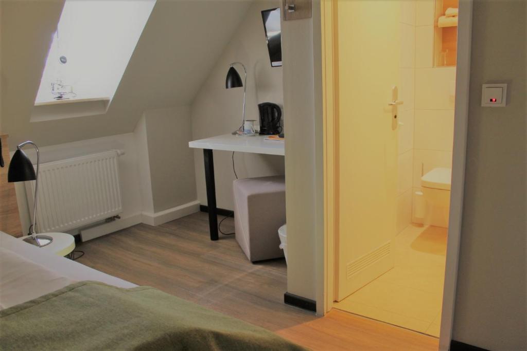 Postel nebo postele na pokoji v ubytování Hotel Eifelbräu