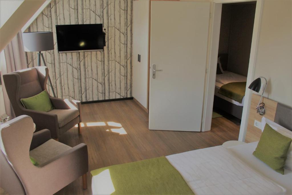 TV a/nebo společenská místnost v ubytování Hotel Eifelbräu