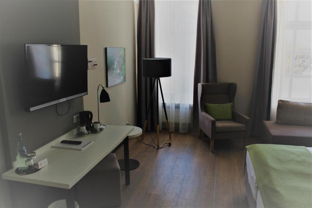 TV a/nebo společenská místnost v ubytování Hotel Eifelbräu