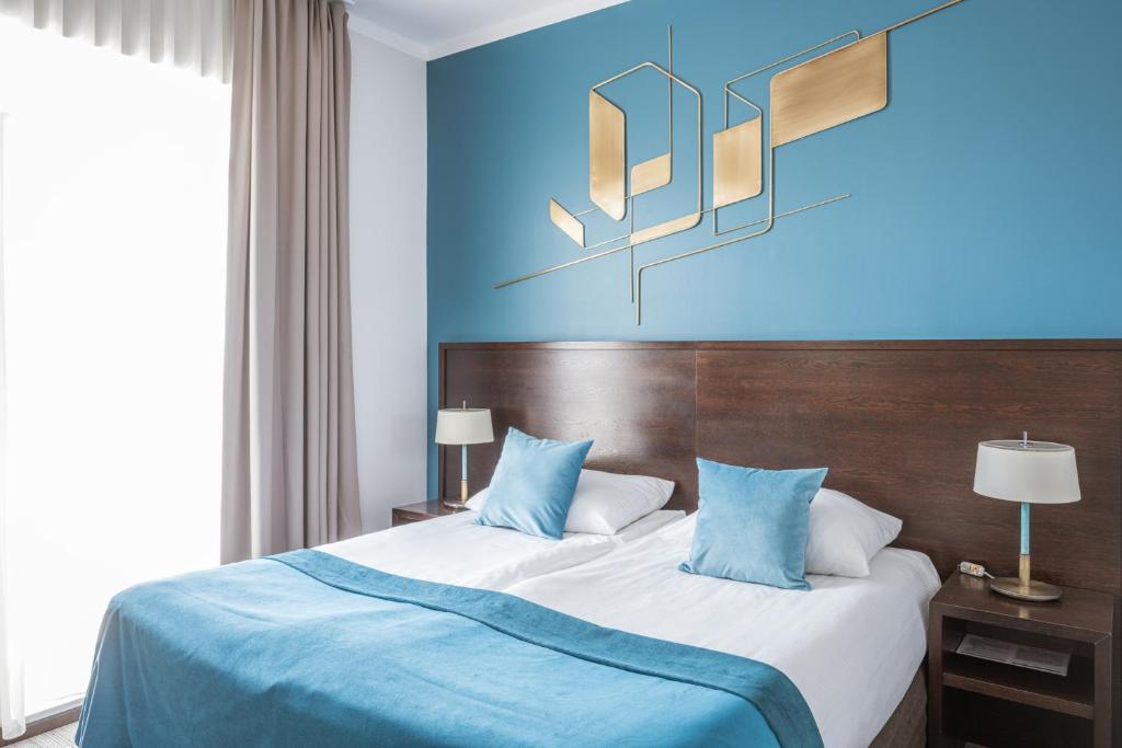 Posteľ alebo postele v izbe v ubytovaní Europeum Hotel