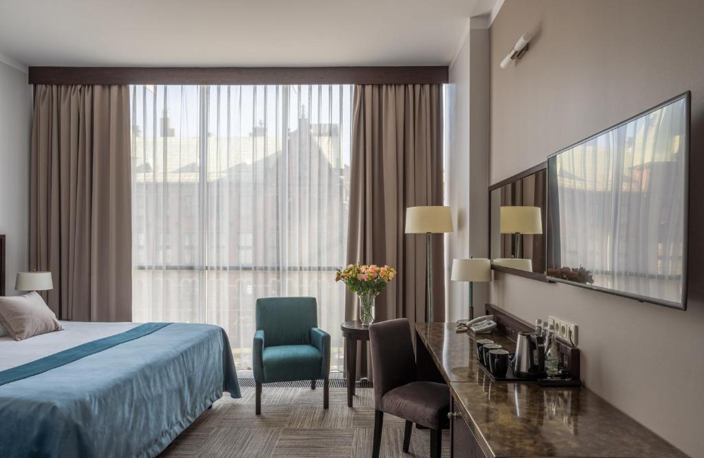 Posteľ alebo postele v izbe v ubytovaní Europeum Hotel