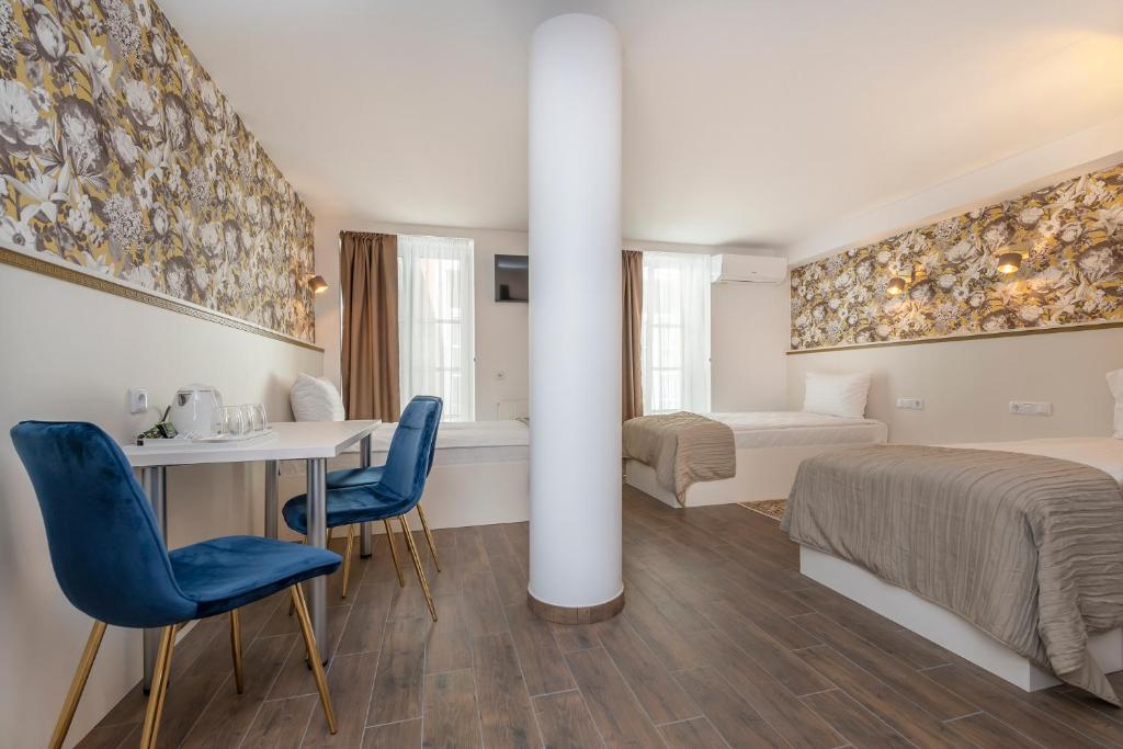Postel nebo postele na pokoji v ubytování Kesminta Apartments