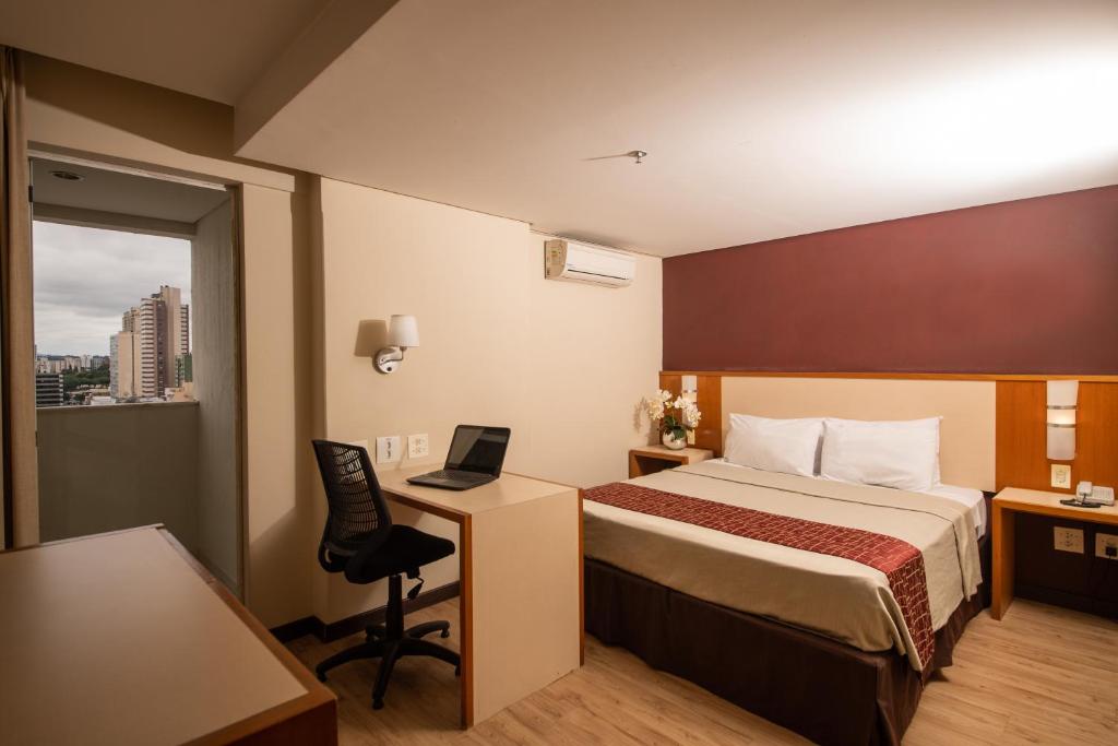 Cama ou camas em um quarto em Rede Andrade CWB