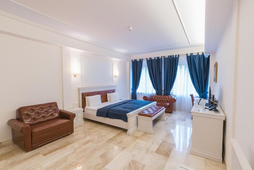 Postel nebo postele na pokoji v ubytování Grand Hotel Palladium
