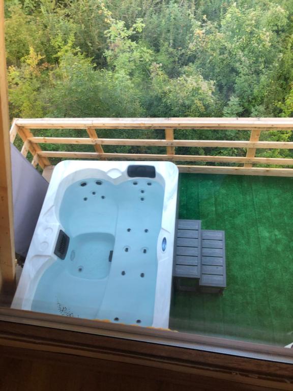 a view of a bath tub on a balcony at Villa Kalaja in Novoberdo