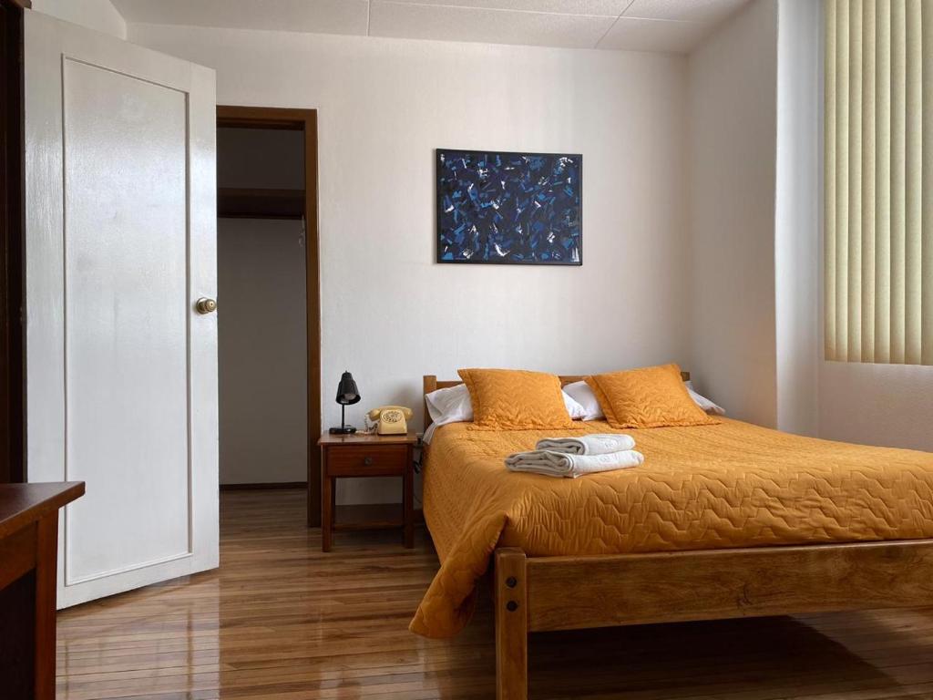 Postel nebo postele na pokoji v ubytování Hotel 9 de Octubre