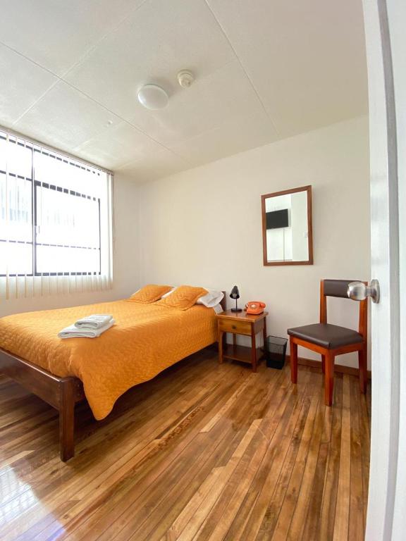 Postel nebo postele na pokoji v ubytování Hotel 9 de Octubre