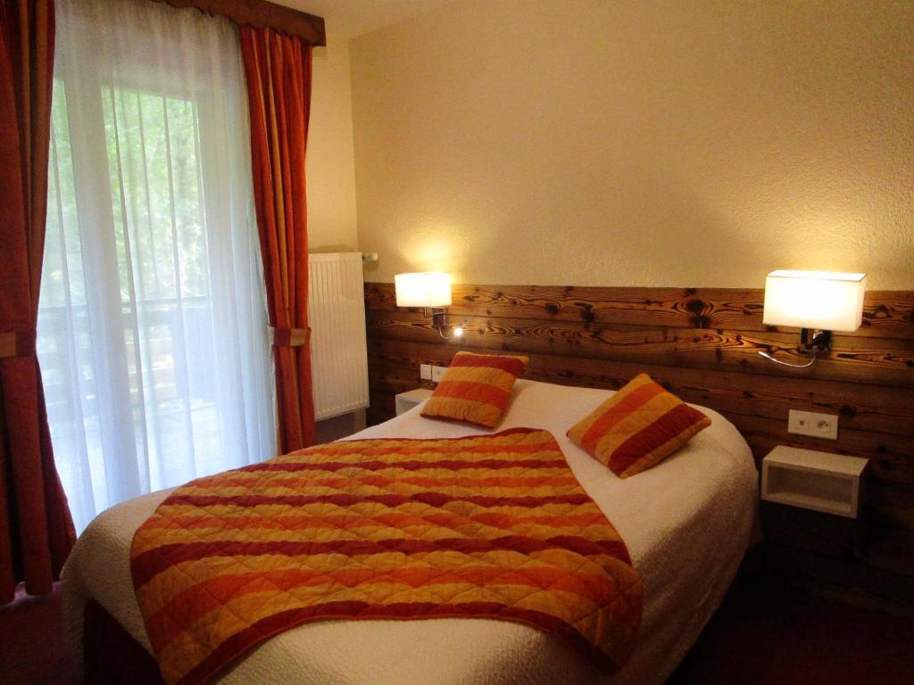 Postel nebo postele na pokoji v ubytování Auberge de la Dranse