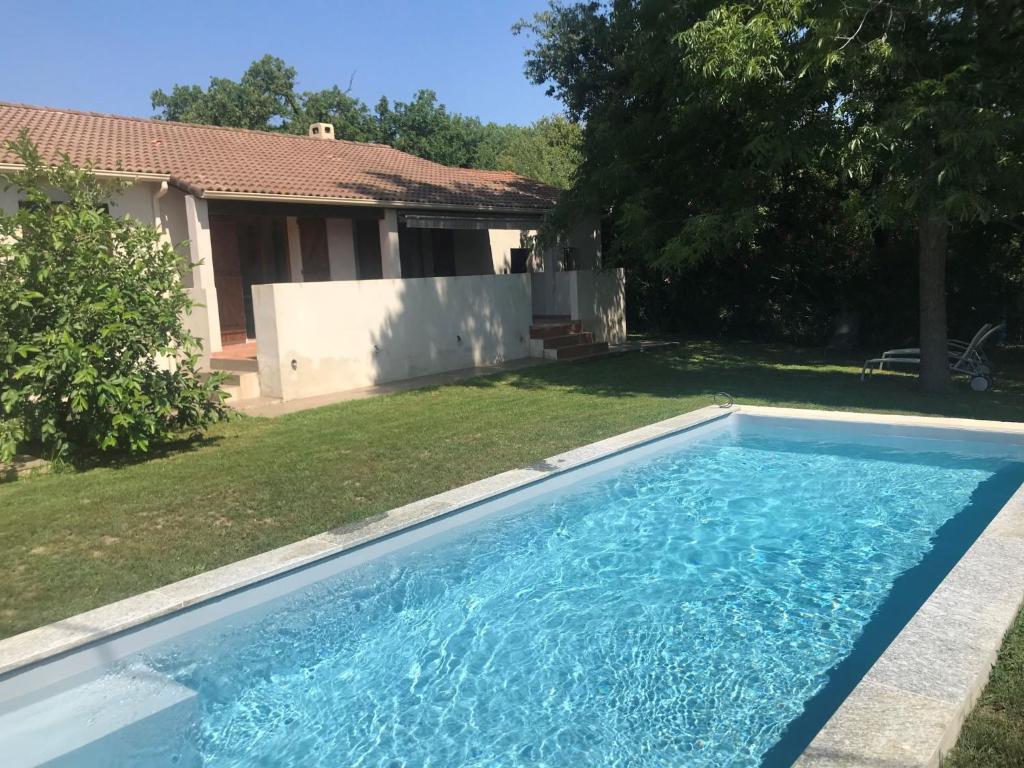 a swimming pool in the yard of a house at Holiday Home Agula Marina - MNI184 by Interhome in Moriani Plage