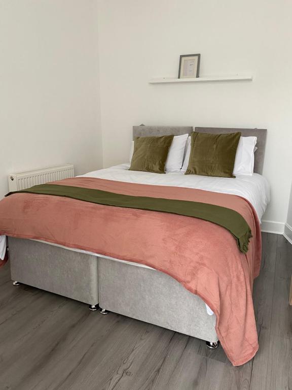 a bedroom with a large bed with at Union Street Apartment in Hawick