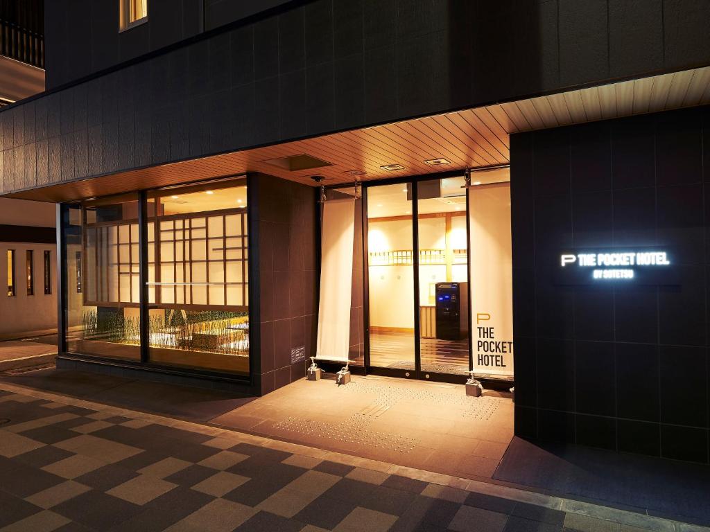 an entrance to a building with a sign on it at THE POCKET HOTEL Kyoto Karasuma Gojo in Kyoto