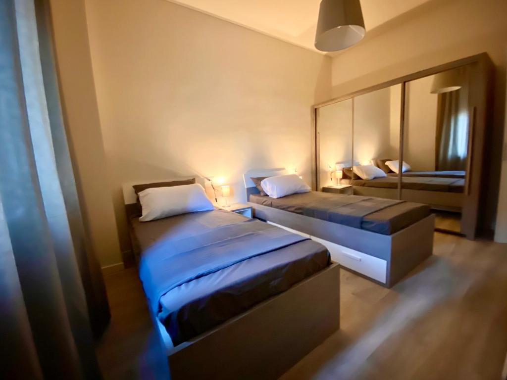 Posteľ alebo postele v izbe v ubytovaní Residenza Bonomi 23