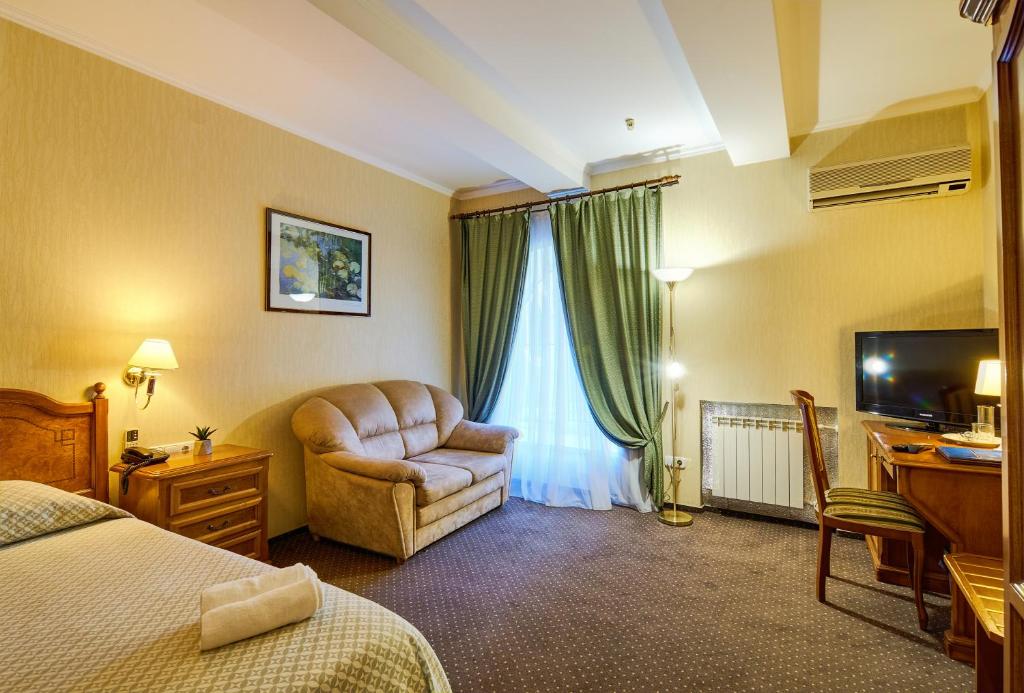 TV a/nebo společenská místnost v ubytování Art Hotel Academy